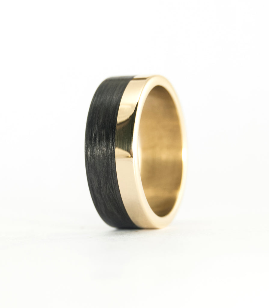 18k Yellow Gold and Carbon Fiber wedding bands.